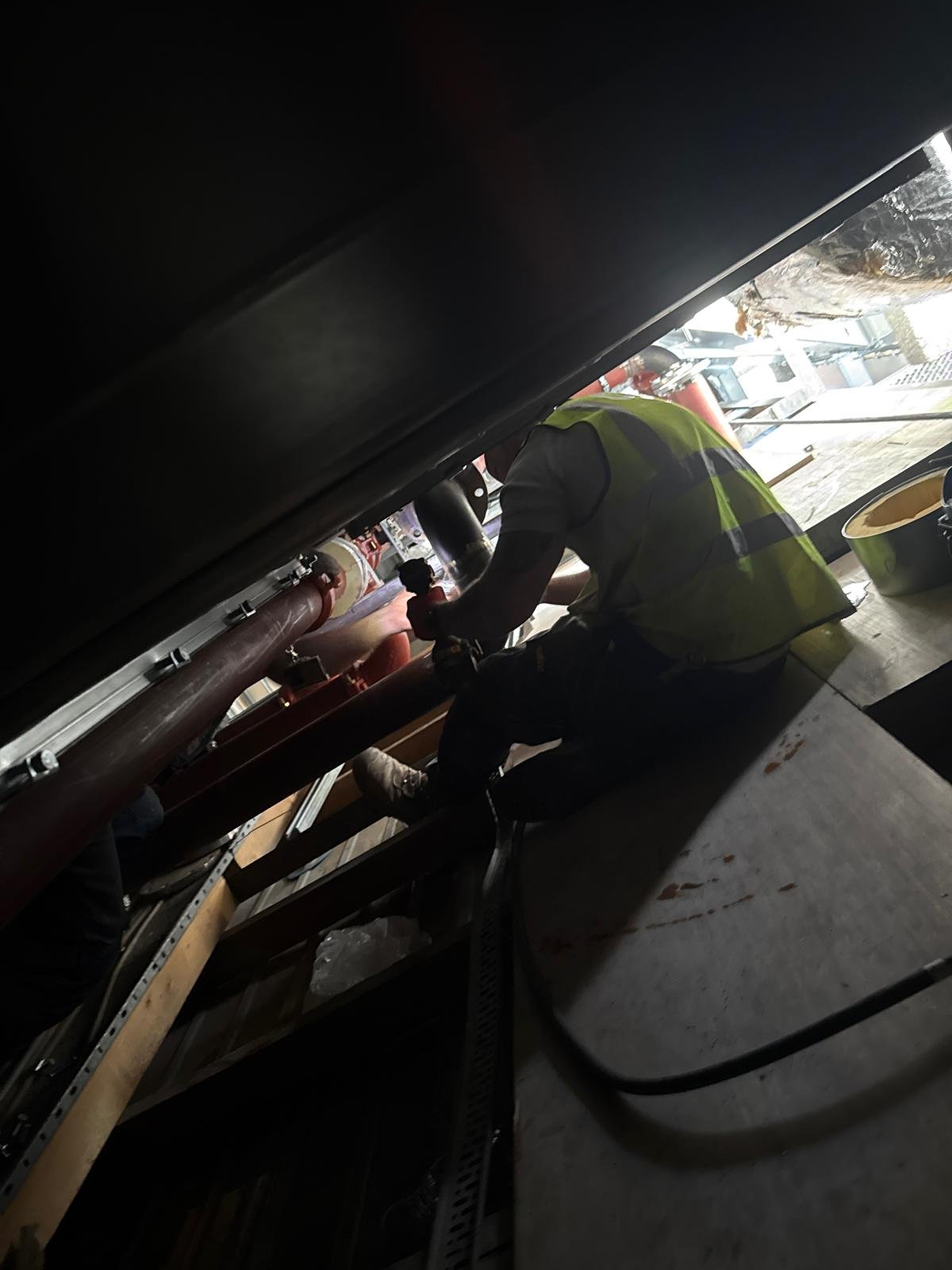 M&F Mechanical engineer working on rooftop plant